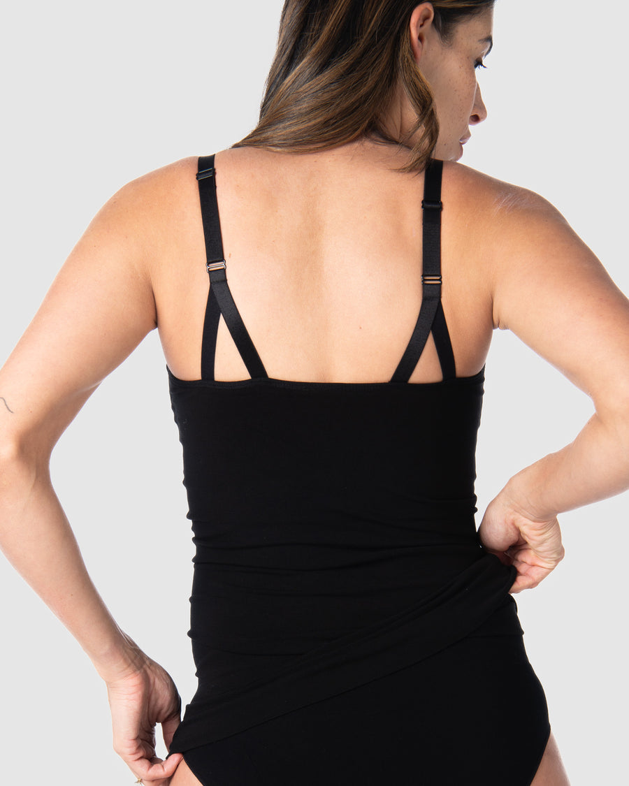 Rear view of the My Necessity Camisole by Hotmilk Lingerie UK in black. This camisole serves as the ideal base layer, featuring a long line design that covers a pregnant belly and offers postpartum comfort and support