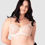 Experience complete support with Hotmilk Lingerie UK's Temptation in Powder. This acclaimed award-winning style boasts flexi underwire, a hint of sheer lace over soft cotton cups, convenient nursing clips, and elevated all-day comfort and support. Olivia confidently wears size 14/36D in this essential nursing and maternity bra