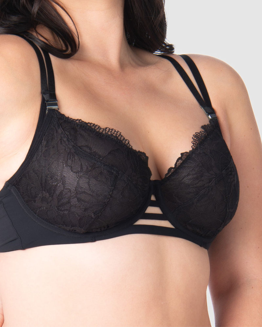 Take a closer look at the True Luxe by Hotmilk Lingerie UK in black, showcasing its contemporary twin strap detailing, semi-sheer full cup coverage, and flexi underwire support. The modern signature magnetic nursing clips and center cutouts elevate this style to the next level of sophistication. Embrace empowerment throughout your breastfeeding journey with this exquisite bra, designed to accommodate cup sizes up to J cup, without making any compromises