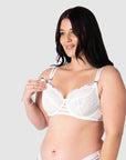 Olivia demonstrates the ease of use with Hotmilk Nursing Lingerie's signature magnetic nursing clips. Experience the finesse of fine lace and full cup design, catering to larger bust sizes up to a J cup