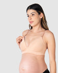 Close-up of Kami, pregnant mother of two, demonstrating the functionality of the HOTMILK UK nursing and maternity bra named AMBITION T-SHIRT WIREFREE in maple, featuring the convenient magnetic nursing clip