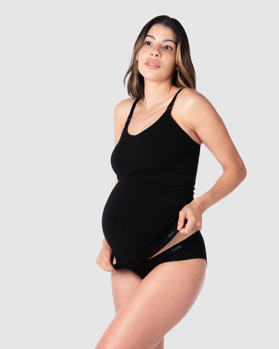 Hotmilk Lingerie's popular Camisole, the My Necessity in Black. Kami, pregnant mother of 2, demonstrates its length and stretch over her baby bump. Enjoy soft, comfortable support for both maternity and postpartum stages, complete with convenient nursing clips for easy breastfeeding