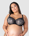 Tiare, a pregnant mother wearing size 16/38F, highlights the wide straps designed for ample support and comfort in larger cup sizes. Hotmilk's award-winning Temptation in Black presents elevated everyday comfort, catering to breastfeeding mothers