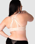 The nursing bra's soft sheer lace straps, delicately hued in shades of pink and featuring the flexibility of a convertible racerback, make it the perfect style to complement any outfit this wedding and party season. Equipped with 6 rows of hooks and eyes, it ensures flexibility throughout your pregnancy and postpartum journey. Hotmilk Lingerie UK offers a nursing bra that harmoniously combines romantic style, flexi underwire support, and the comfort of soft cotton cups like no other