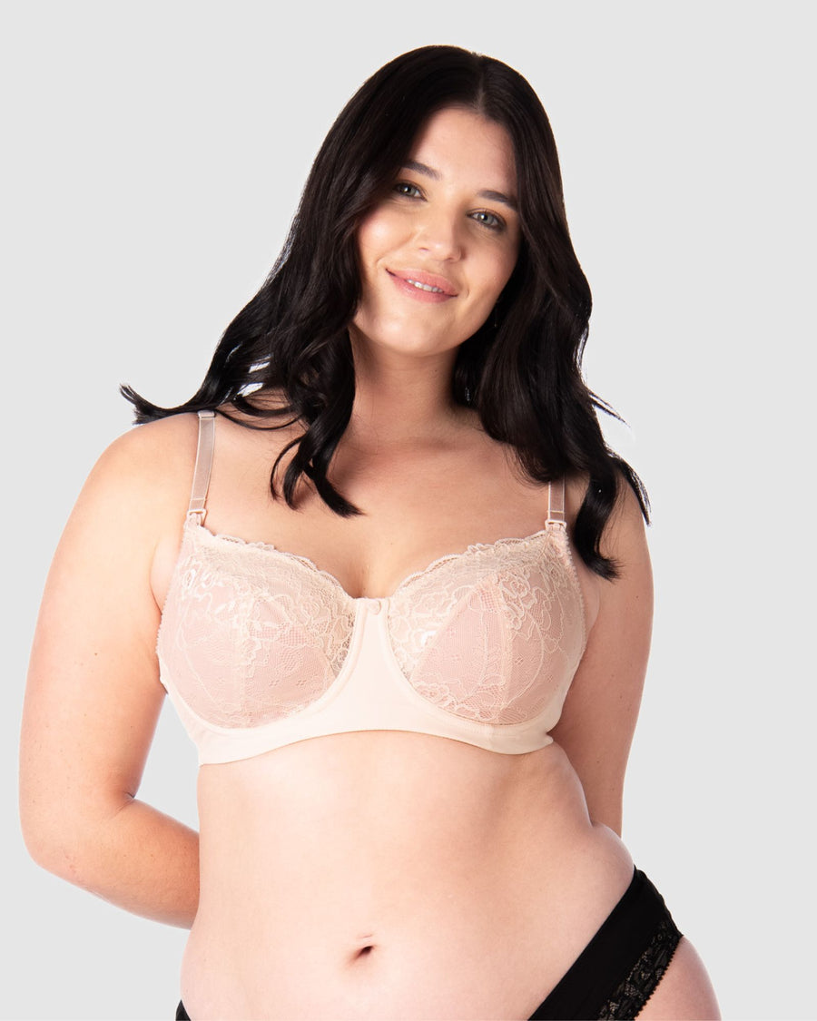 Experience complete support with Hotmilk Lingerie UK's Temptation in Powder. This acclaimed award-winning style boasts flexi underwire, a hint of sheer lace over soft cotton cups, convenient nursing clips, and elevated all-day comfort and support. Olivia confidently wears size 14/36D in this essential nursing and maternity bra