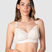Kami, a mother of two, revels in the comfort and versatile style of Hotmilk Lingerie's Warrior Soft Cup. This wire-free maternity and nursing bra offers the ideal blend of lightness and youthfulness, boasting rose gold magnetic nursing clips and sheer graphic lace for a contemporary touch. Experience comfort and style seamlessly combined in this modern maternity essentia