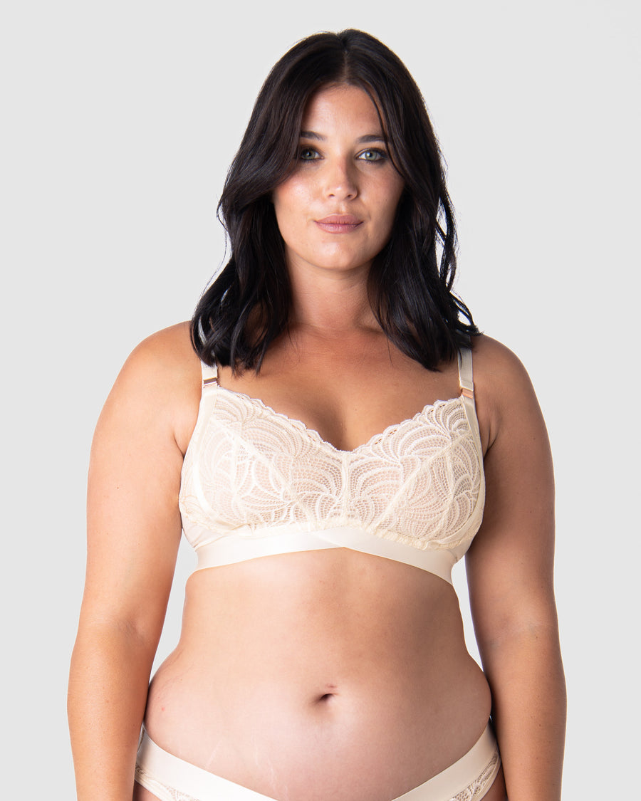 Discover ultimate comfort and style with Olivia embracing the Warrior Soft Cup by Hotmilk Lingerie. This wire-free maternity and nursing bra present a perfect fusion of lightness and youthfulness, featuring rose gold magnetic nursing clips and sheer graphic lace for a contemporary touch. Immerse yourself in the seamless combination of comfort and style, making this modern maternity essential a must-have