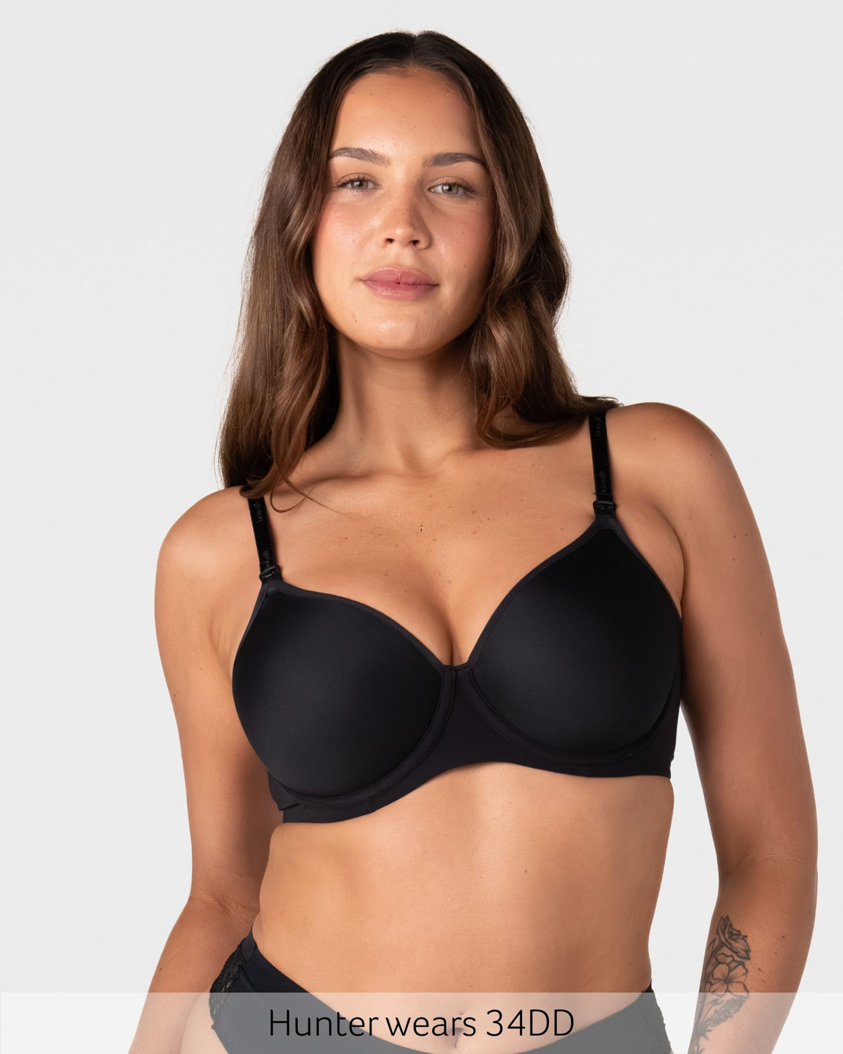 Hunter wears size 34DD in the Forever New black t-shirt nursing bra with seamless spacer foam cups for a smooth everyday fit